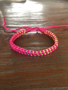 Gevlochten koord armbandje pink